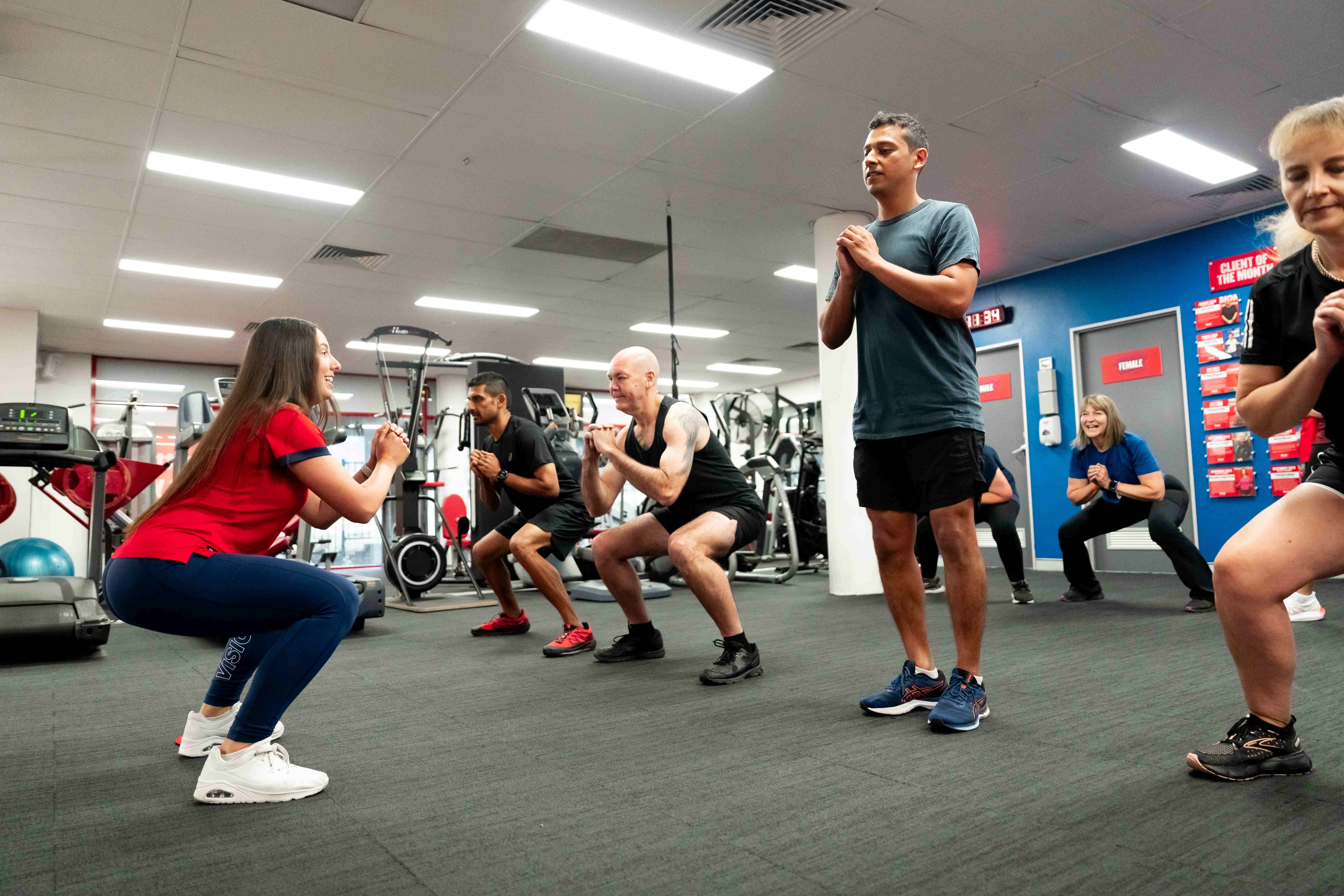 Group fitness class at Vision Personal Training fostering social connections for fat loss and wellness.