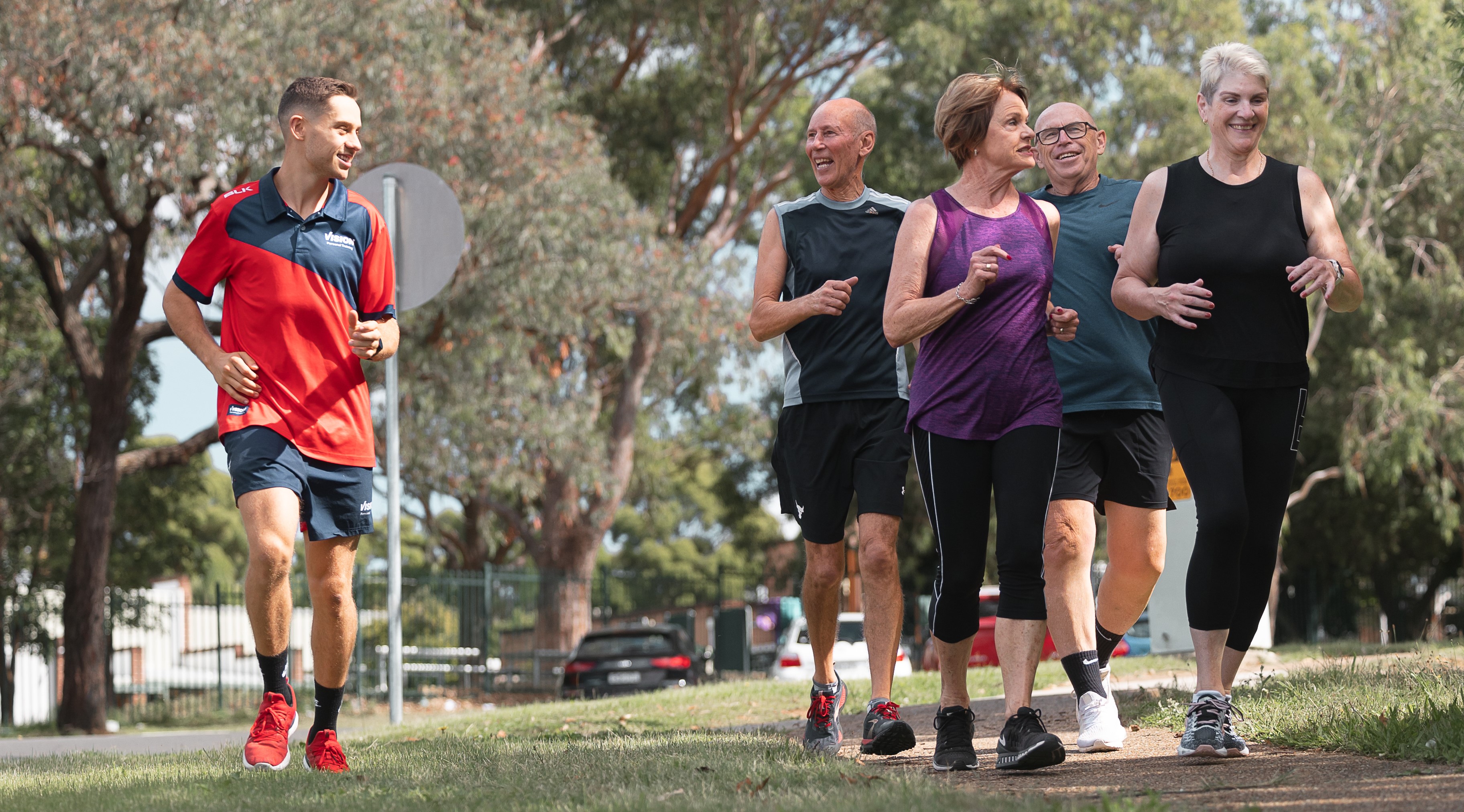 Vision Personal Training clients celebrating long-term health and fitness success together as a supportive community.